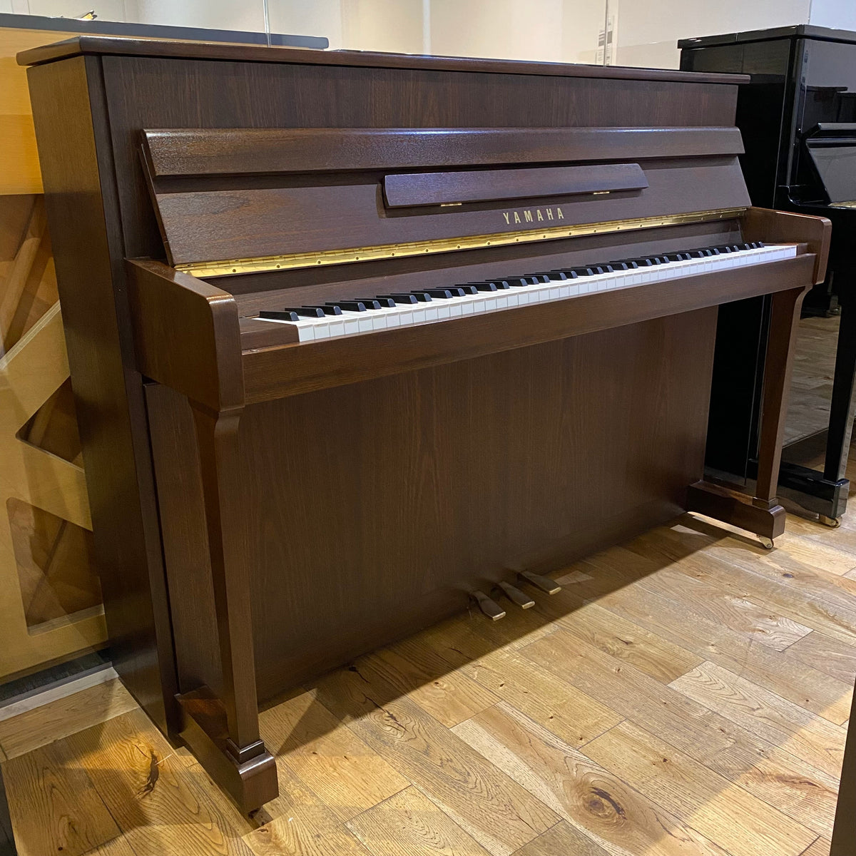 Pre-owned Yamaha P110NT upright piano in satin walnut